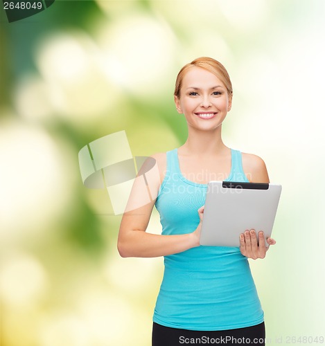 Image of sporty woman with tablet pc