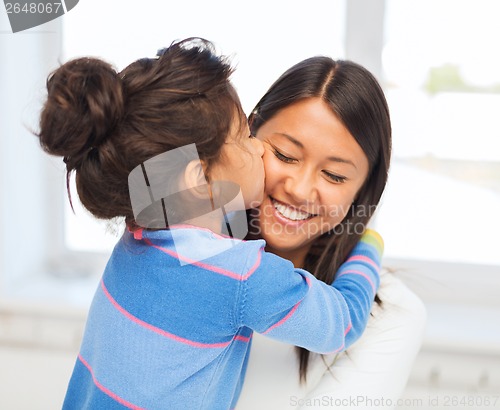 Image of hugging mother and daughter