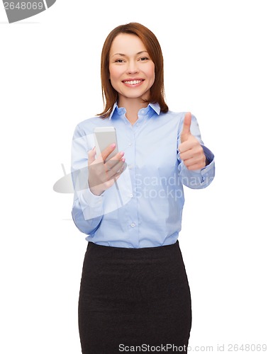 Image of young smiling businesswoman with smartphone