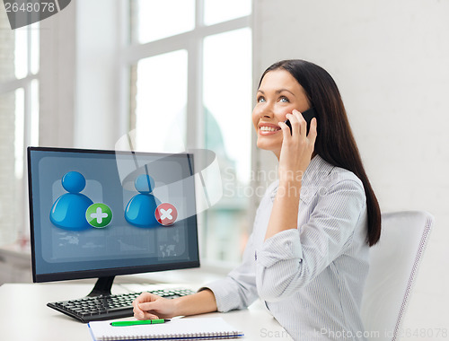 Image of smiling businesswoman or student with smartphone