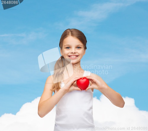 Image of girl in blank white shirt with small red heart