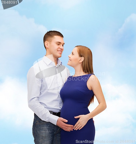 Image of happy young family expecting child