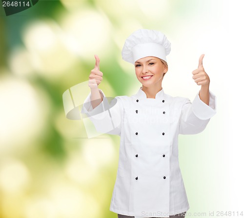 Image of smiling female chef showing thumbs up