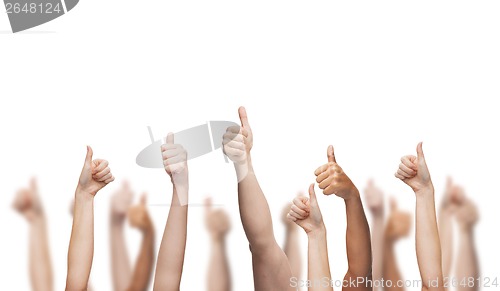 Image of human hands showing thumbs up