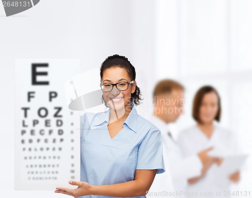 Image of female doctor or nurse with white blank board