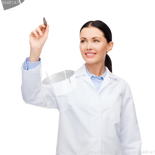 Image of female doctor working with something imaginary