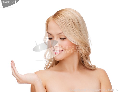 Image of smiling woman holding something imaginary