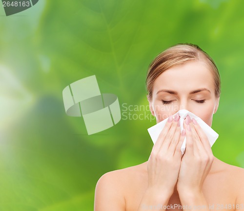 Image of beautiful woman with paper tissue