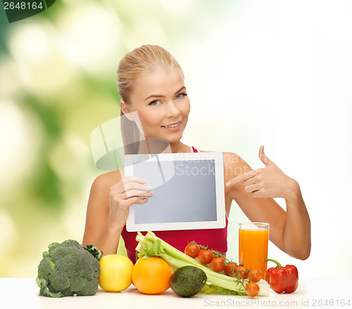 Image of woman with fruits, vegetables and tablet pc