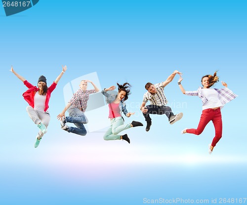 Image of group of teenagers jumping