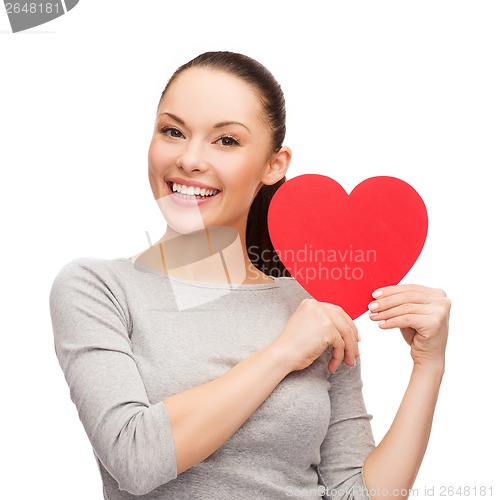 Image of smiling asian woman with red heart