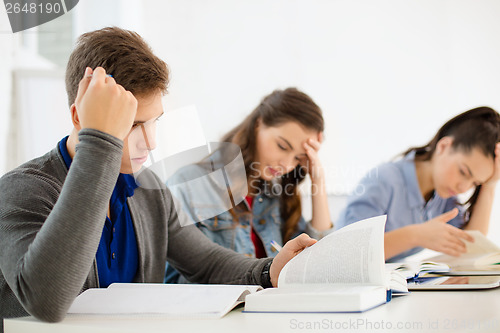 Image of students with notebooks and tablet pc at school