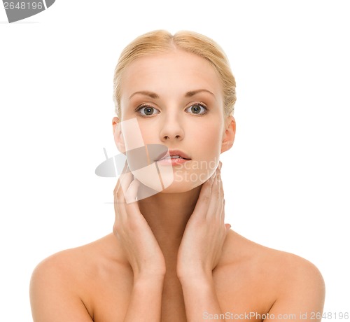 Image of beautiful woman touching her face skin