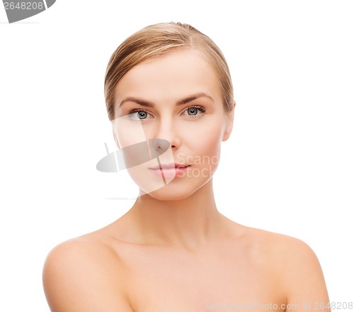 Image of face and shoulders of young woman