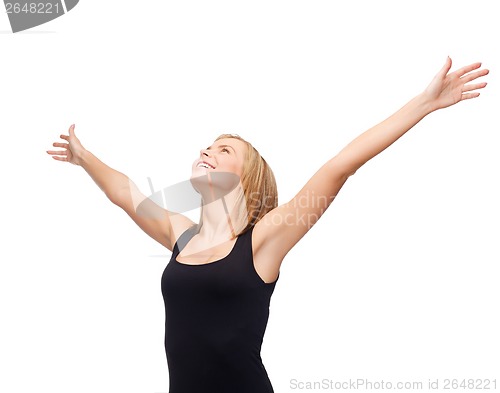 Image of smiling girl in blank black tank top waving hands