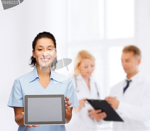 Image of smiling female doctor or nurse with tablet pc