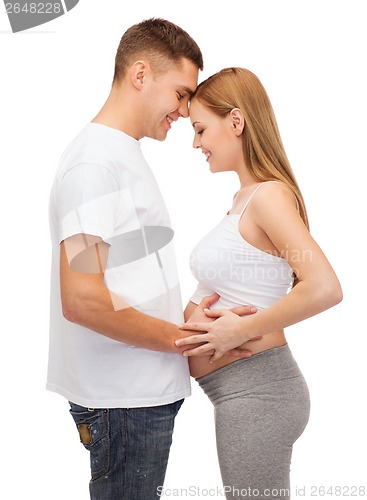 Image of happy young family expecting child