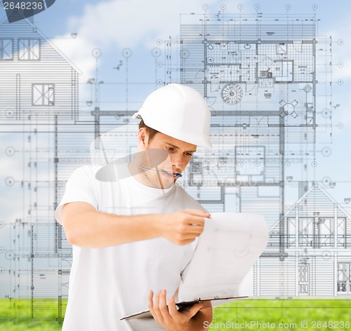 Image of male architect looking at blueprint