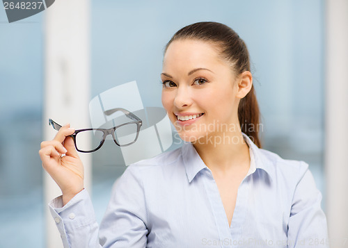 Image of laughing businesswoman with glasses