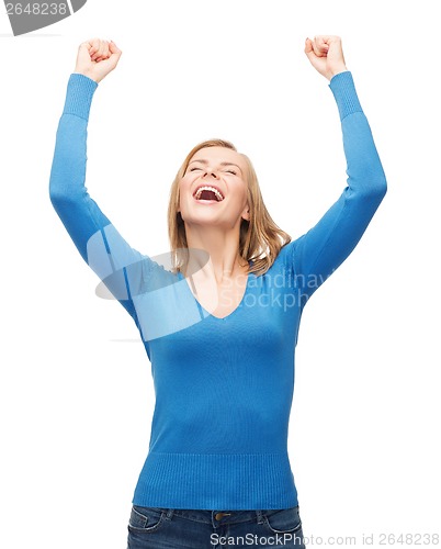 Image of laughing young woman with hands up