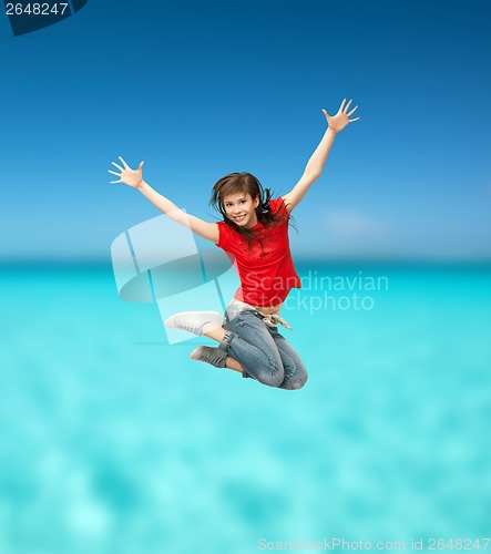 Image of smiling girl jumping