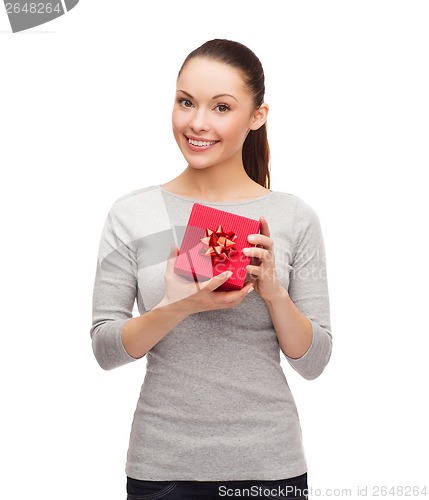Image of beautiful girl with red gift box