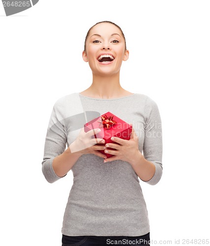 Image of beautiful girl with red gift box