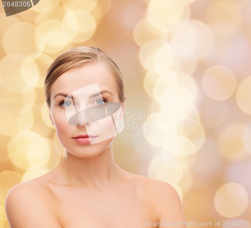 Image of face and shoulders of young woman