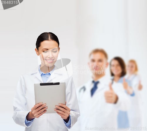 Image of female doctor without stethoscope and tablet pc