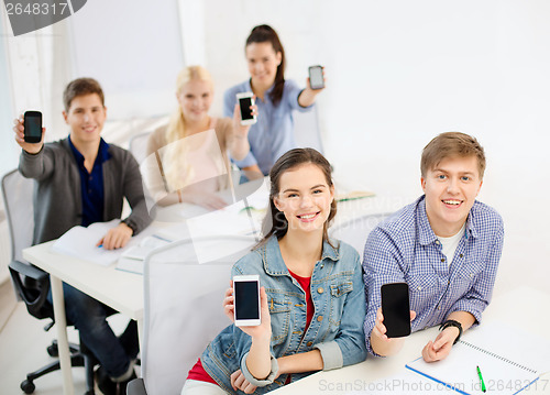 Image of students showing black blank smartphone screens