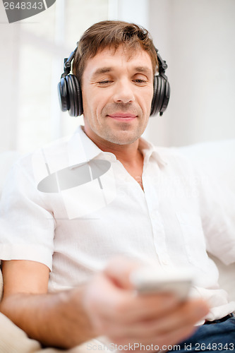 Image of man with headphones listening to music