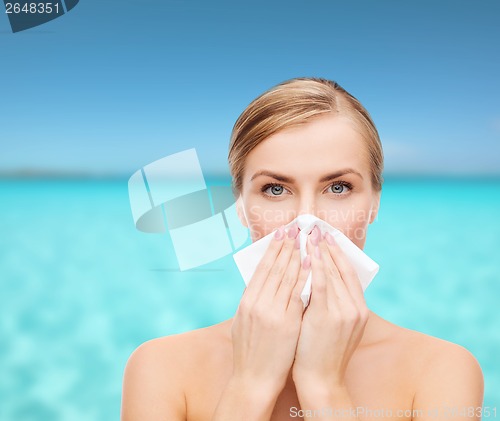 Image of beautiful woman with paper tissue