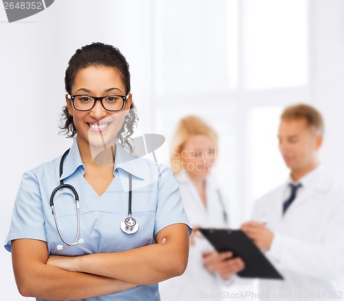 Image of smiling female african american doctor or nurse