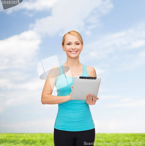 Image of sporty woman with tablet pc
