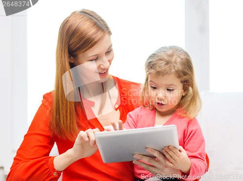 Image of happy mother and daughter with tablet pc computer