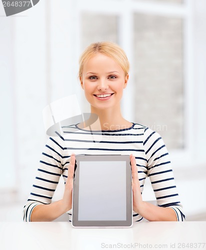 Image of smiling teenage girl with blank tablet pc screen
