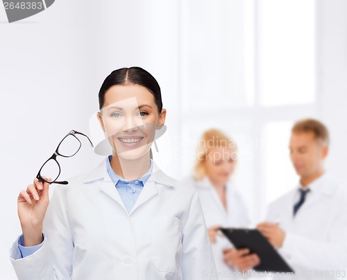 Image of smiling female doctor with eyeglasses