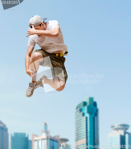 Image of male dancer jumping in the air