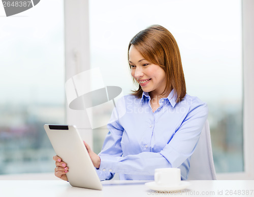 Image of smiling businesswoman or student with tablet pc