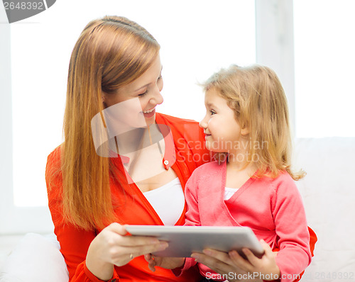 Image of happy mother and daughter with tablet pc computer