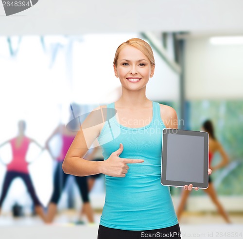 Image of sporty woman with tablet pc blank screen