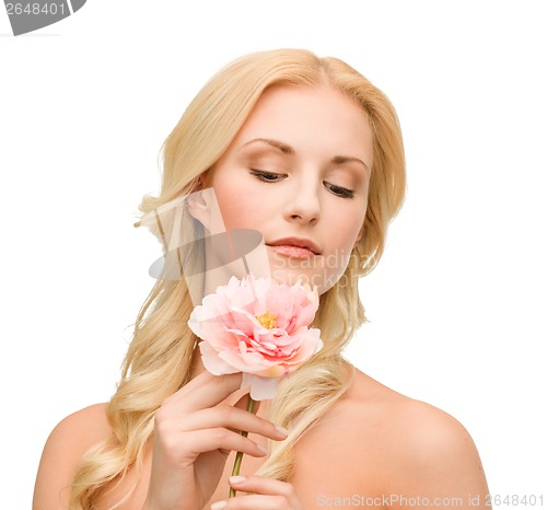 Image of lovely woman with peony flower