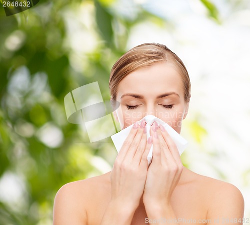 Image of beautiful woman with paper tissue