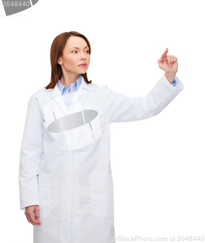 Image of doctor pointing to something or pressing button