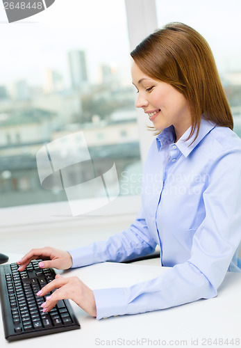 Image of smiling businesswoman or student with computer