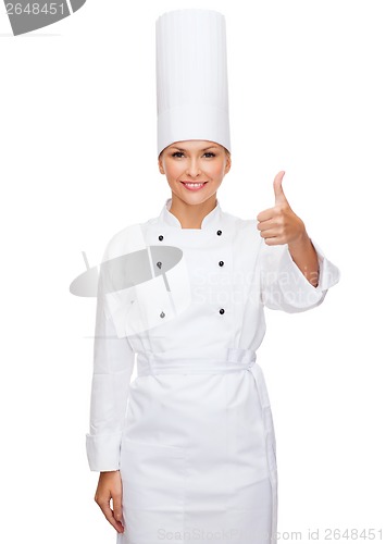 Image of smiling female chef showing thumbs up