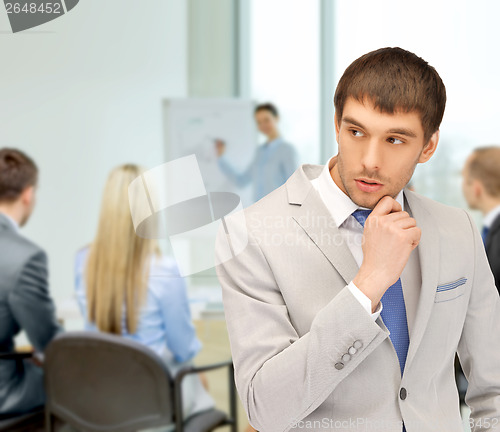 Image of pensive man at office