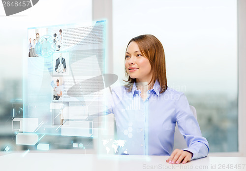 Image of smiling woman pointing to news on virtual screen