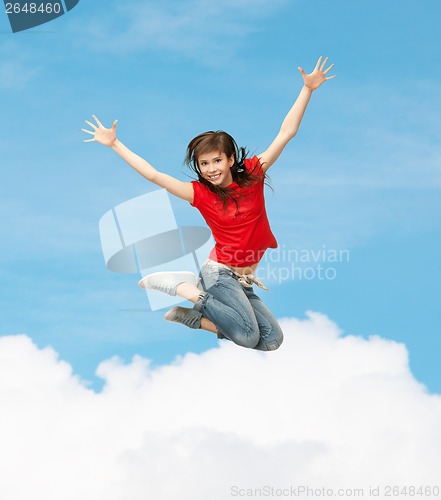 Image of smiling girl jumping