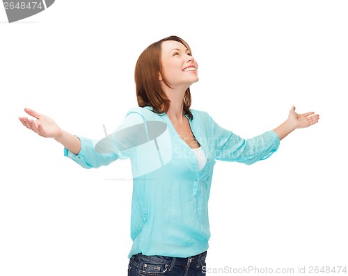 Image of smiling woman waving hands